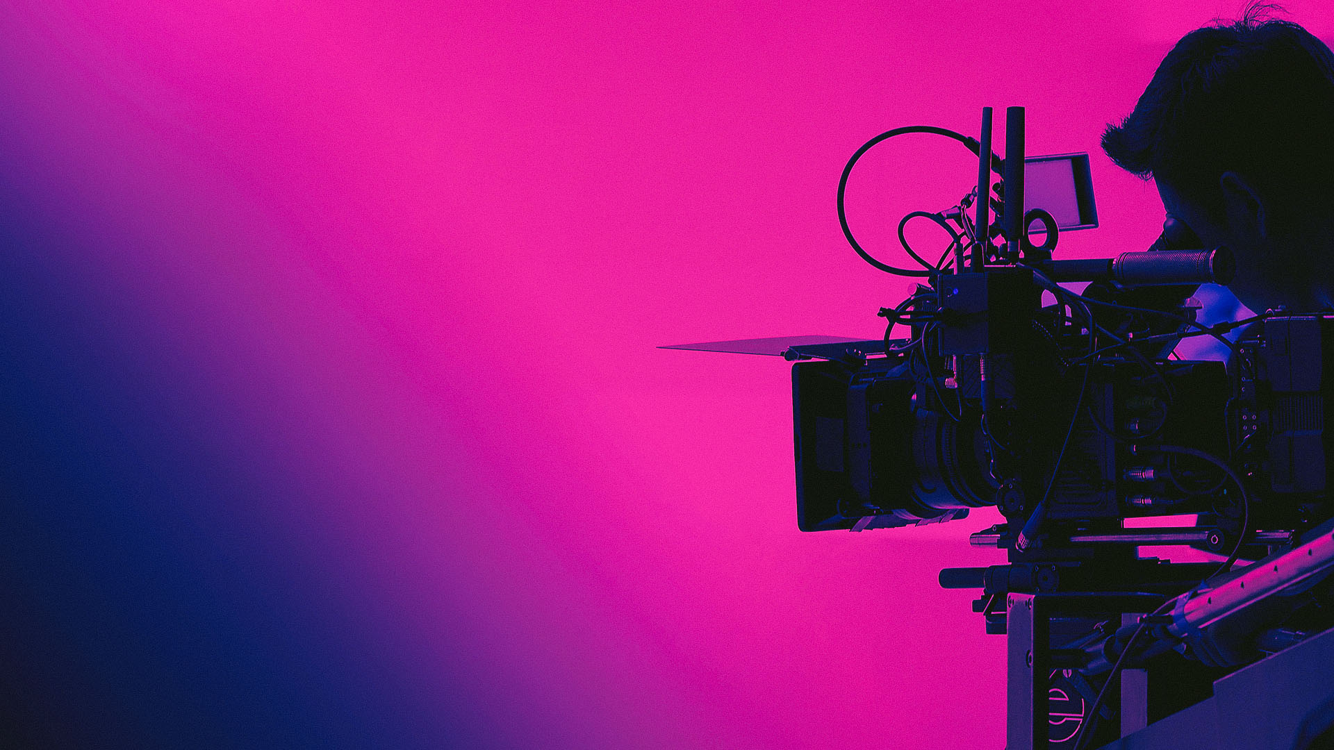 Stylized silhouette of a camera and a camera operator filming a video